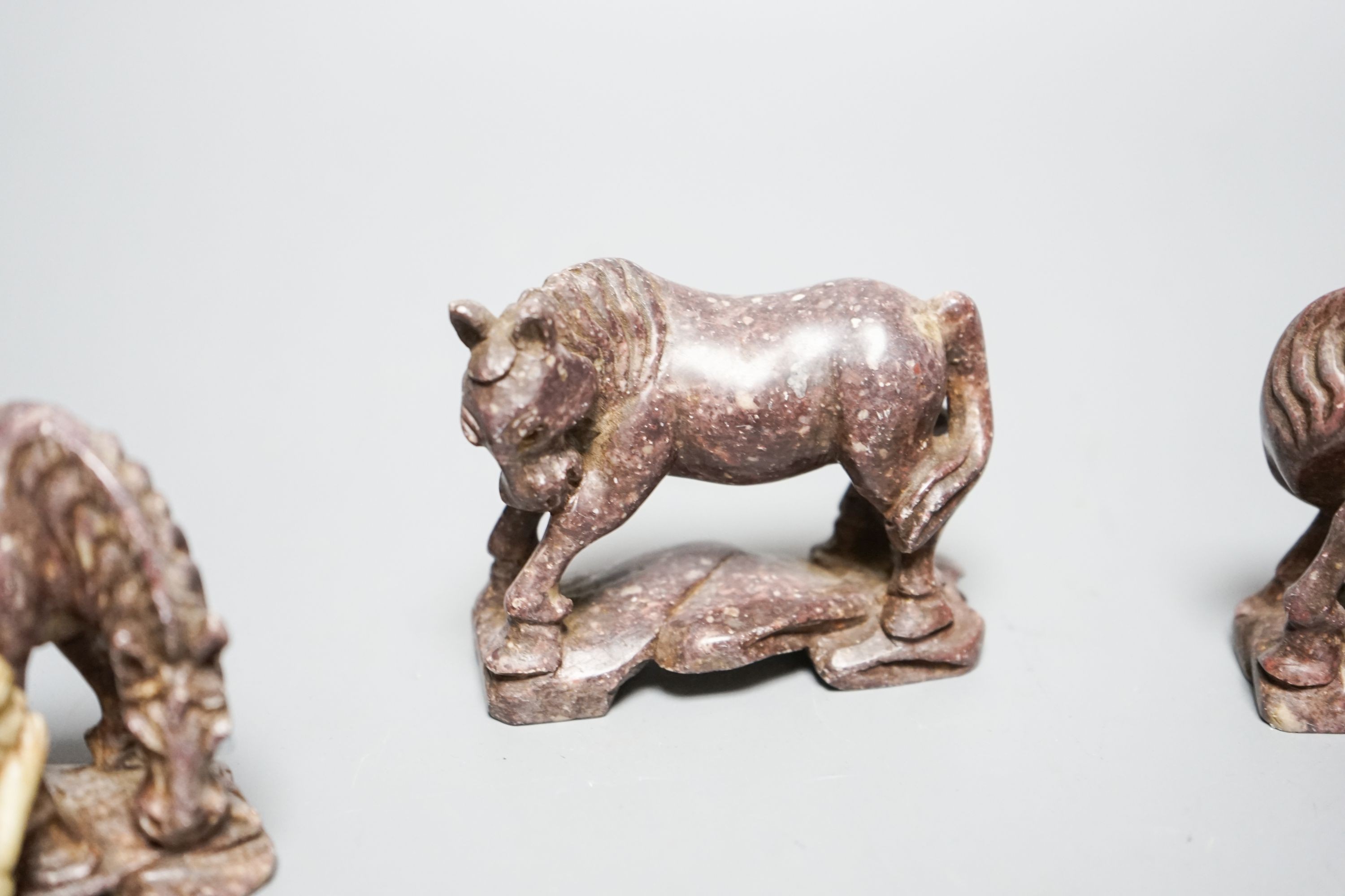 Six Chinese soapstone models of horses and a similar monkey, early 20th century